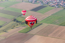 Hot air balloon with hat face in the district Bauschlott in Neulingen in the state Baden-Wuerttemberg, Germany