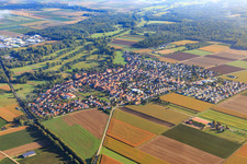 Aerial view of Location overview between clouds from the southwest in Steinweiler in the state Rhineland-Palatinate, Germany