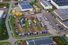 Aerial view of Storage space for unsold Daimler Actros trucks on the former disco parking lot in the district Minderslachen in Kandel in the state Rhineland-Palatinate, Germany
