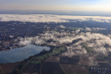 Aerial view of Gravel pit for gravel extraction by Pfadt GmbH Kieswerk-Baustoffe under clouds in Leimersheim in the state Rhineland-Palatinate, Germany