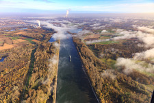 Course of the Rhine and Rhine dam cycle path under clouds from the south in Hördt in the state Rhineland-Palatinate, Germany