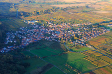 Wine-growing village from the west between autumn-colored vineyards in Oberotterbach in the state Rhineland-Palatinate, Germany