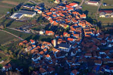 Kirchgasse with cemetery and St. Ludwig Church and warehouses of the Ehrhart winery in Eschbach in the state Rhineland-Palatinate, Germany
