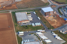Aerial view of Industrial area in Speyer Valley with TRANSAC International Speditionsgesellschaft mbH and construction site of the new Kardex Software GmbH building in Rülzheim in the state Rhineland-Palatinate, Germany