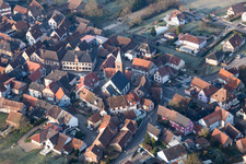 Aerial photograpy of Protestantic Church building in the center of a circle of houses in the village of in Dossenheim-sur-Zinsel in Grand Est, France
