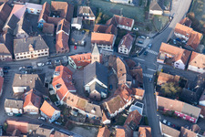 Protestantic Church building in the center of a circle of houses in the village of in Dossenheim-sur-Zinsel in Grand Est, France out of the air