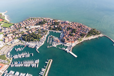 Aerial view of Pleasure boat marina with docks and moorings on the shore area of the Adriatic sea and old town of Novigrad in Istrien - Istarska zupanija, Croatia