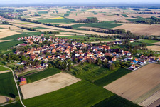 Aerial view of Village - view on the edge of agricultural fields and farmland in Hoffen in Grand Est, France