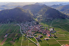 Wine village on the edge of the Haardt from the east in spring in Eschbach in the state Rhineland-Palatinate, Germany