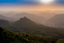 Trifels Fortress in the evening mist above the Palatinate Forest in Annweiler am Trifels in the state Rhineland-Palatinate, Germany
