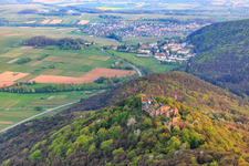 Madenburg castle ruins on an autumnally colored mountain in the Palatinate Forest from the north in Eschbach in the state Rhineland-Palatinate, Germany