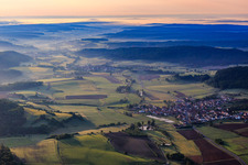 Village view in the morning from the west in the valley of the Rauhe Ebrach in the district Geusfeld in Rauhenebrach in the state Bavaria, Germany