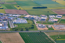 Aerial view of Carl-Benz-Straße commercial area from the east in Rülzheim in the state Rhineland-Palatinate, Germany