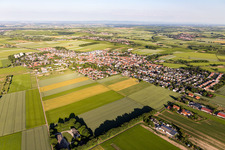 Village view on the edge of agricultural fields and land in Mainz-Ebersheim in the state Rhineland-Palatinate, Germany