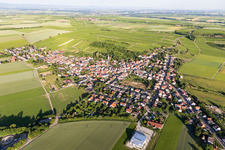 Drone image of Agricultural land and field borders surround the settlement area of the village in Dittelsheim-Hessloch in the state Rhineland-Palatinate, Germany