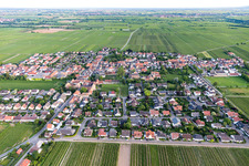 Agricultural land and field borders surround the settlement area of the village in Friedelsheim in the state Rhineland-Palatinate, Germany