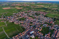 Village view on the edge of agricultural fields and land in Niederkirchen bei Deidesheim in the state Rhineland-Palatinate, Germany