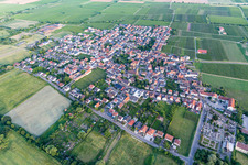 Agricultural land and field borders surround the settlement area of the village in Ruppertsberg in the state Rhineland-Palatinate, Germany