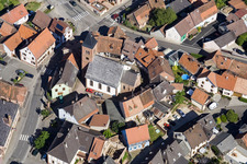 Protestantic Church building in the center of a circle of houses in the village of in Dossenheim-sur-Zinsel in Grand Est, France