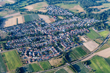 Aerial photograpy of Agricultural land and field borders surround the settlement area of the village in Hanhofen in the state Rhineland-Palatinate, Germany