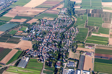 Agricultural land and field borders surround the settlement area of the village in Weingarten (Pfalz) in the state Rhineland-Palatinate, Germany