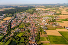 Village view on the edge of agricultural fields and land in Herxheim bei Landau (Pfalz) in the state Rhineland-Palatinate, Germany