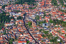 And main street from the east with St. Maria Himmelfahrt in Herxheim bei Landau in the state Rhineland-Palatinate, Germany
