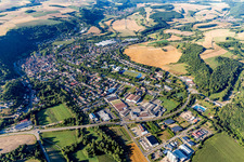Aerial view of Location view of the streets and houses of residential areas in the Glan valley landscape surrounded by hills in Meisenheim in the state Rhineland-Palatinate, Germany