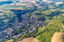 Location view of the streets and houses of residential areas in the valley landscape surrounded by mountains in Alsenz in the state Rhineland-Palatinate, Germany
