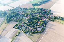 Agricultural land and field borders surround the settlement area of the village in Natendorf in the state Lower Saxony, Germany