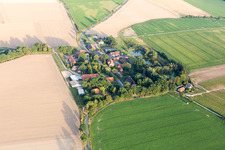 Agricultural land and field borders surround the settlement area of the village in Addenstorf in the state Lower Saxony, Germany