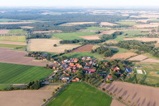 Agricultural land and field borders surround the settlement area of the village in Bienenbuettel in the state Lower Saxony, Germany