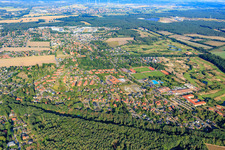 View of the town from the east with Walter-Maack ice stadium, outdoor swimming pool, sports fields and sports hall of the school center and TSV Adendorf v. 1923 eV in Adendorf in the state Lower Saxony, Germany