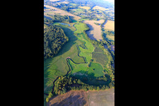 Aerial view of The Schaale stream meanders between meadows in the district Bretzin in Bengerstorf in the state Mecklenburg-Western Pomerania, Germany