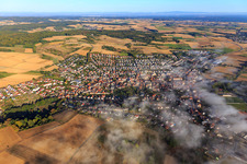 View of the town with low clouds from the southeast in Groß-Bieberau in the state Hesse, Germany