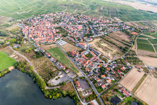 Agricultural land and field borders surround the settlement area of the village in Sommerach in the state Bavaria, Germany