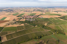 Agricultural land and field borders surround the settlement area of the village in Neuses a.Berg in the state Bavaria, Germany
