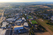 View of the town from the east with the sports park and industrial area Neulandstraße and H+E Group and French Consulting GmbH in Sinsheim in the state Baden-Wuerttemberg, Germany