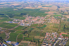 View of the winegrowing village between vineyards from the southwest in Niederkirchen bei Deidesheim in the state Rhineland-Palatinate, Germany