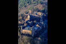 Aerial view of Madenburg Castle Ruins: Remains of an 11th-century hilltop castle surrounded by forests with a restaurant in Eschbach in the state Rhineland-Palatinate, Germany