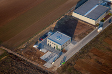 Aerial view of New building construction site in the industrial park Gewerbepark West with M-Systems IT Solutions in Herxheim bei Landau (Pfalz) in the state Rhineland-Palatinate, Germany