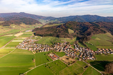 Agricultural land and field borders surround the settlement area of the village in Heuweiler in the state Baden-Wurttemberg, Germany