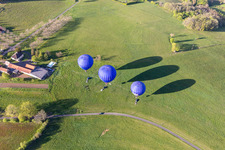 Aerial view of Hot air balloons launching over the airspace in Veyrines-de-Domme in Nouvelle-Aquitaine, France