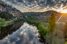 Chateau de la Malartrie over the Dordogne at sunrise from a balloon in La Roque-Gageac in the state Dordogne, France