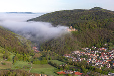 Landeck Castle in the morning mist in Klingenmünster in the state Rhineland-Palatinate, Germany from above