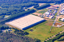 Industrial park Waldstückerring from the north with the hall of Continental Reifen GmbH and GreenGarden Garten Bau in Bellheim in the state Rhineland-Palatinate, Germany