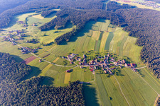 Aerial view of Surrounded by forest and forest areas center of the streets and houses and residential areas in Aichelberg in the state Baden-Wurttemberg, Germany