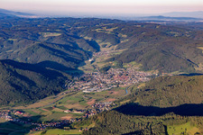 Aerial photograpy of Location view of the streets and houses of residential areas in the valley landscape surrounded by mountains of the black forest in Haslach im Kinzigtal in the state Baden-Wurttemberg, Germany