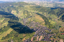 Location view of the streets and houses of residential areas in the valley landscape surrounded by mountains in Berghaupten in the state Baden-Wurttemberg, Germany