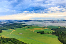 Aerial view of From the southeast under fog in Neuhausen ob Eck in the state Baden-Wuerttemberg, Germany